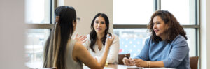 Image of three women talking